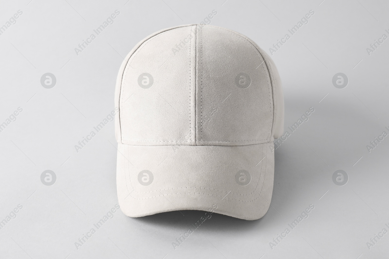 Photo of Stylish baseball cap on light grey background. Mockup for design