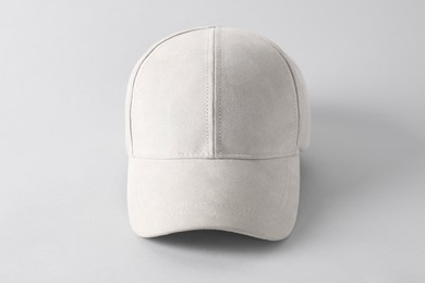 Photo of Stylish baseball cap on light grey background. Mockup for design