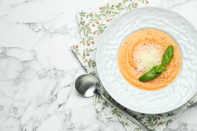 Photo of Delicious sweet potato soup served on white marble table, flat lay. Space for text