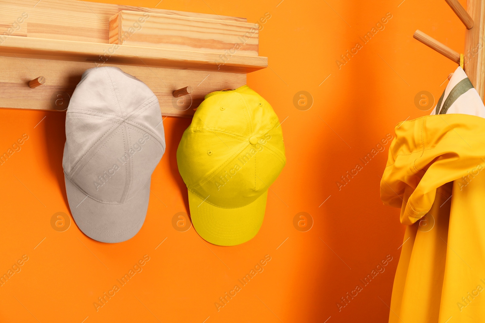 Photo of Stylish baseball caps indoors. Mockup for design