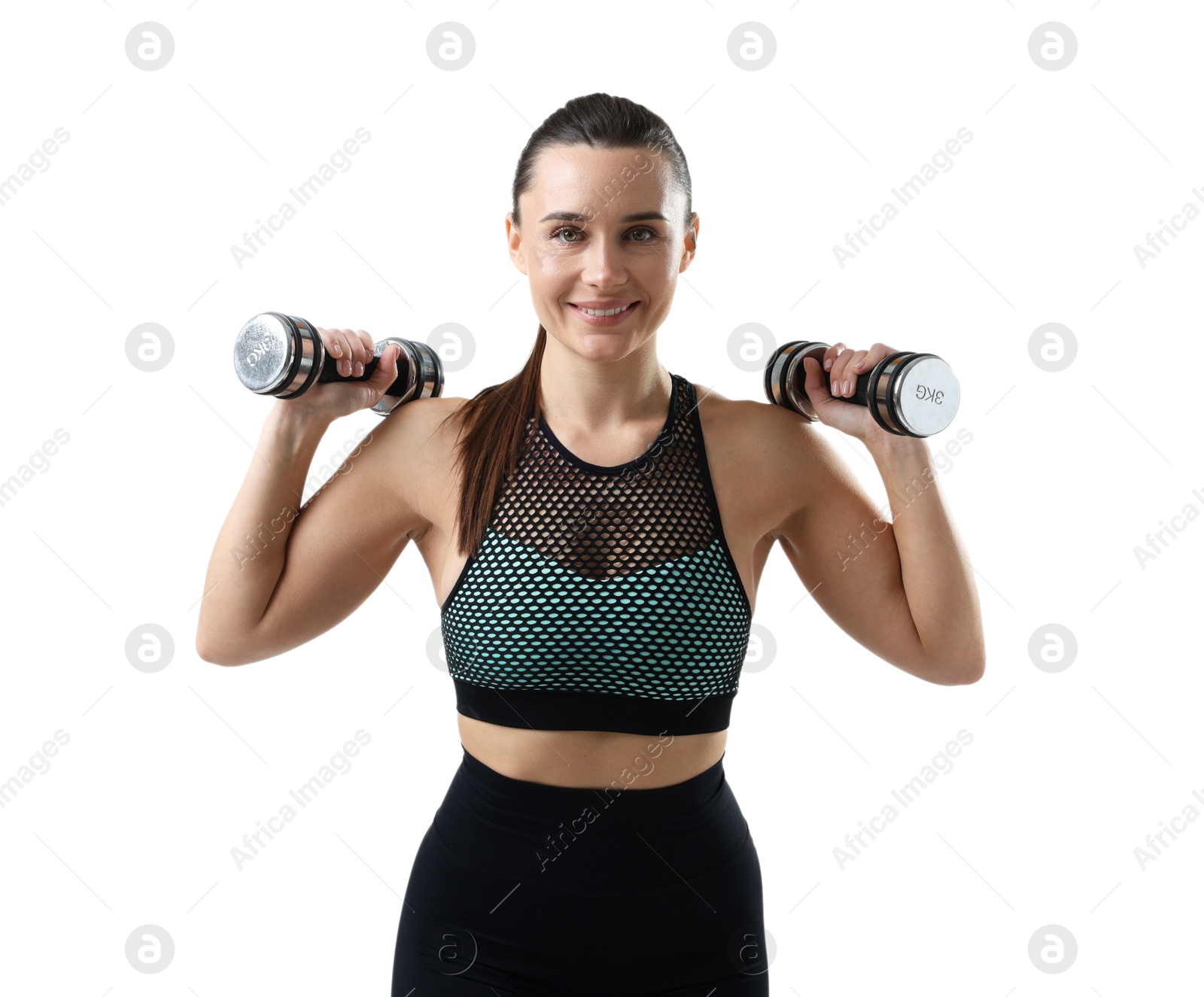 Photo of Smiling woman in sportswear training with dumbbells on white background