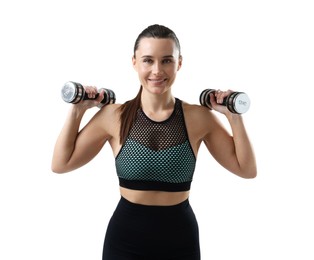 Photo of Smiling woman in sportswear training with dumbbells on white background