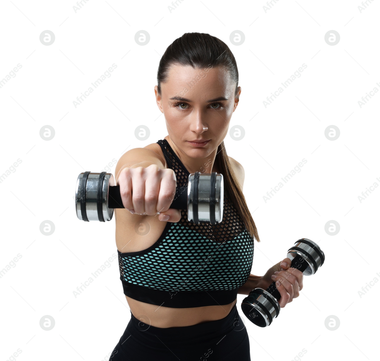 Photo of Beautiful woman in sportswear training with dumbbells on white background