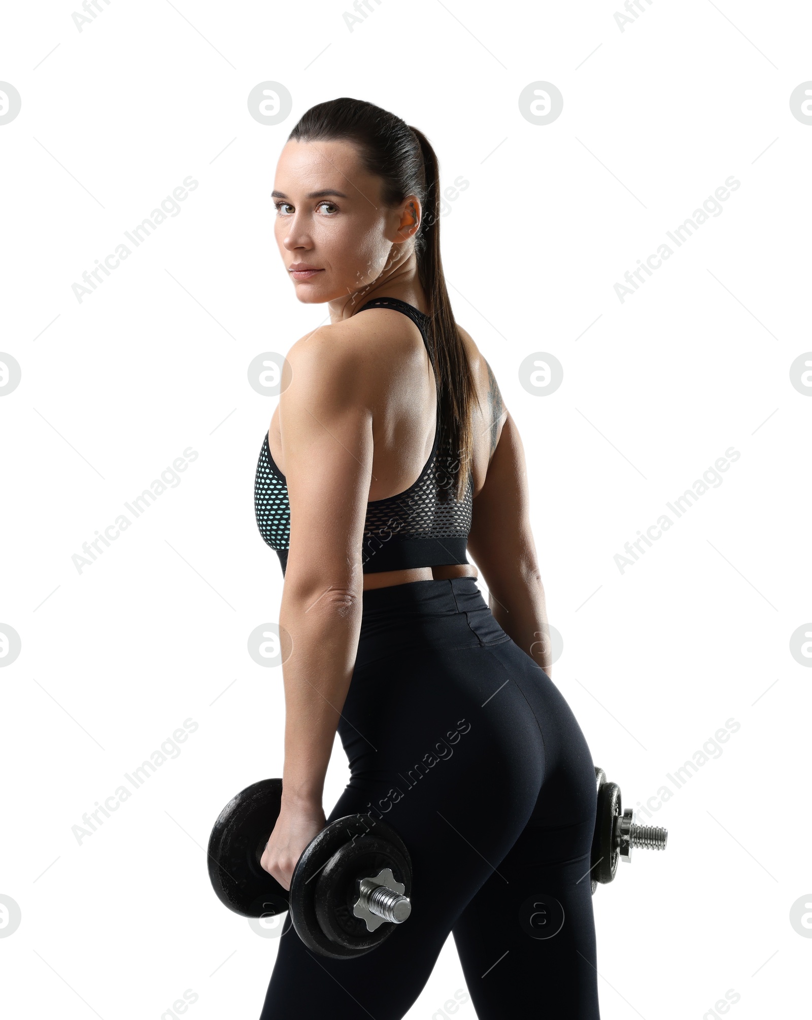 Photo of Beautiful woman in sportswear training with barbells on white background