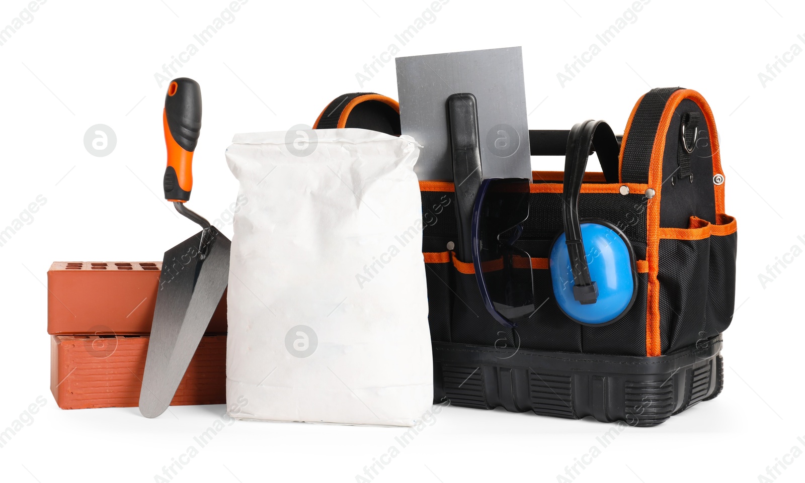 Photo of Bag with construction tools and building materials isolated on white