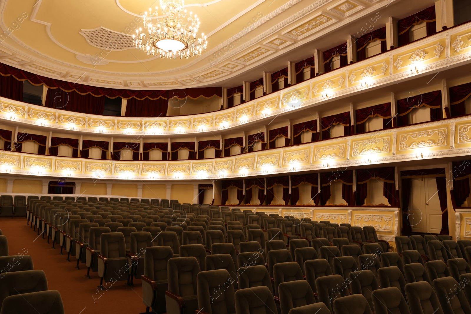 Photo of Rows of gray comfortable seats in theatre