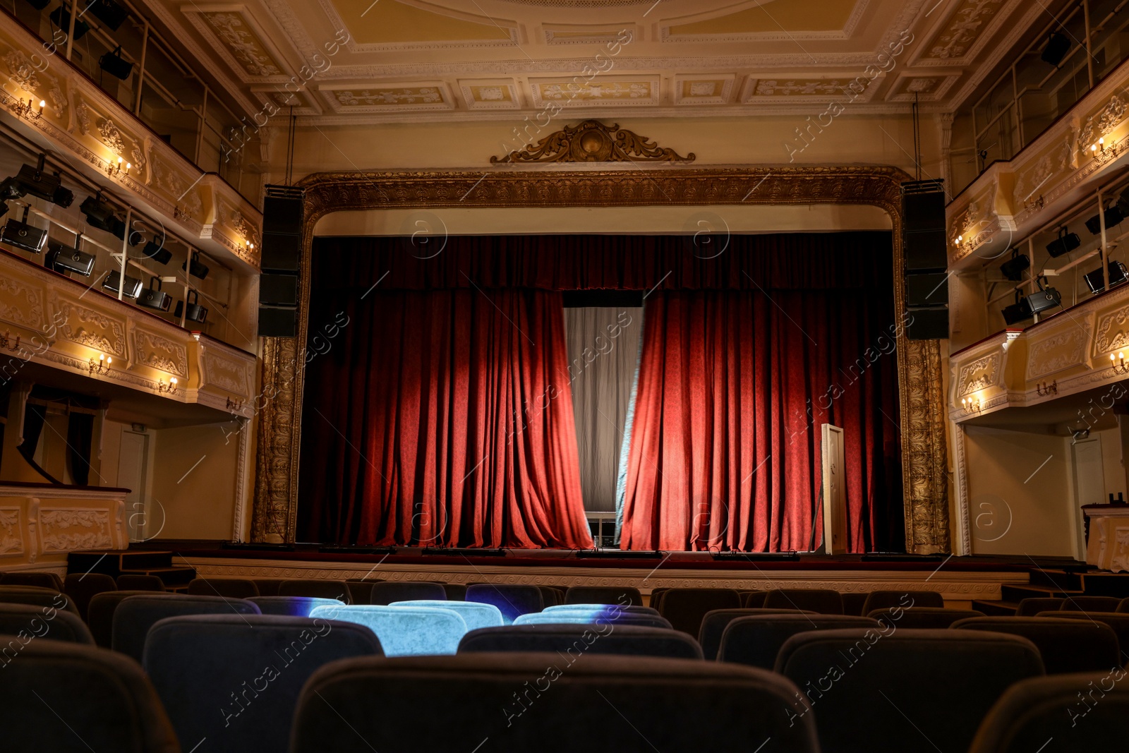 Photo of Theatre interior with stage and rows of comfortable seats