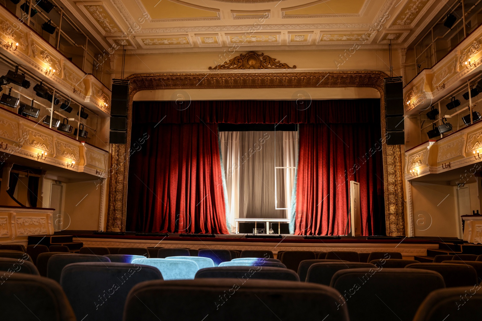 Photo of Theatre interior with stage and rows of comfortable seats