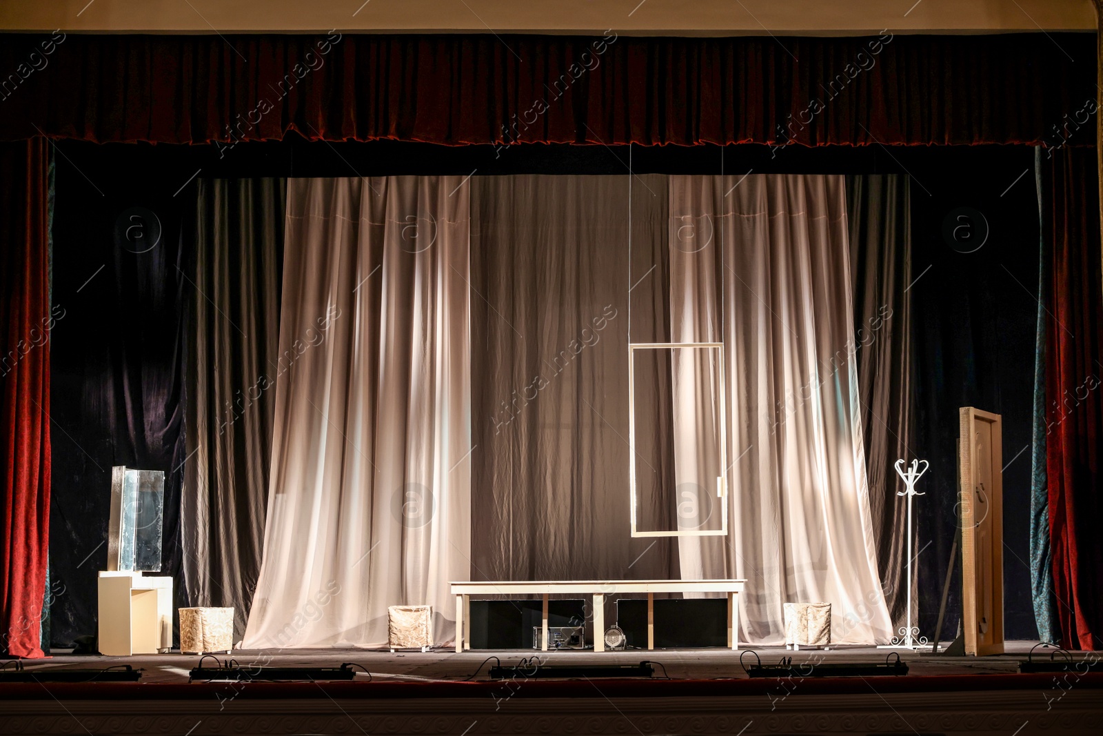 Photo of Different furniture and other decorations on stage in theatre