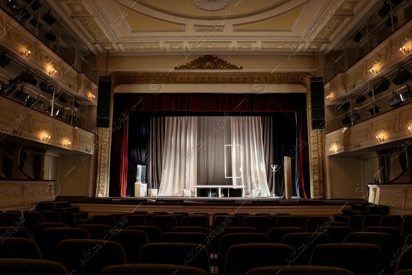 Photo of Theatre interior with stage and rows of comfortable seats