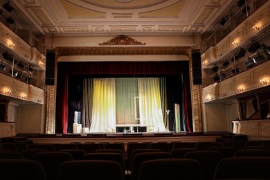 Photo of Theatre interior with stage and rows of comfortable seats