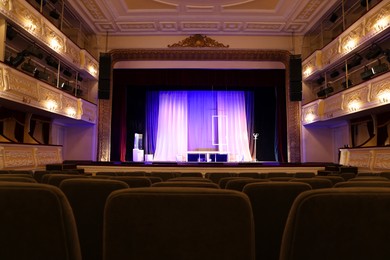 Photo of Theatre interior with stage and rows of comfortable seats