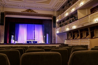 Theatre interior with stage and rows of comfortable seats