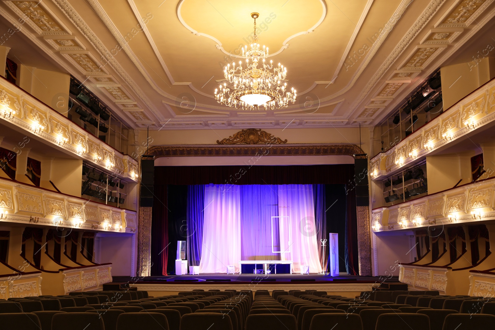 Photo of Theatre interior with stage and rows of comfortable seats