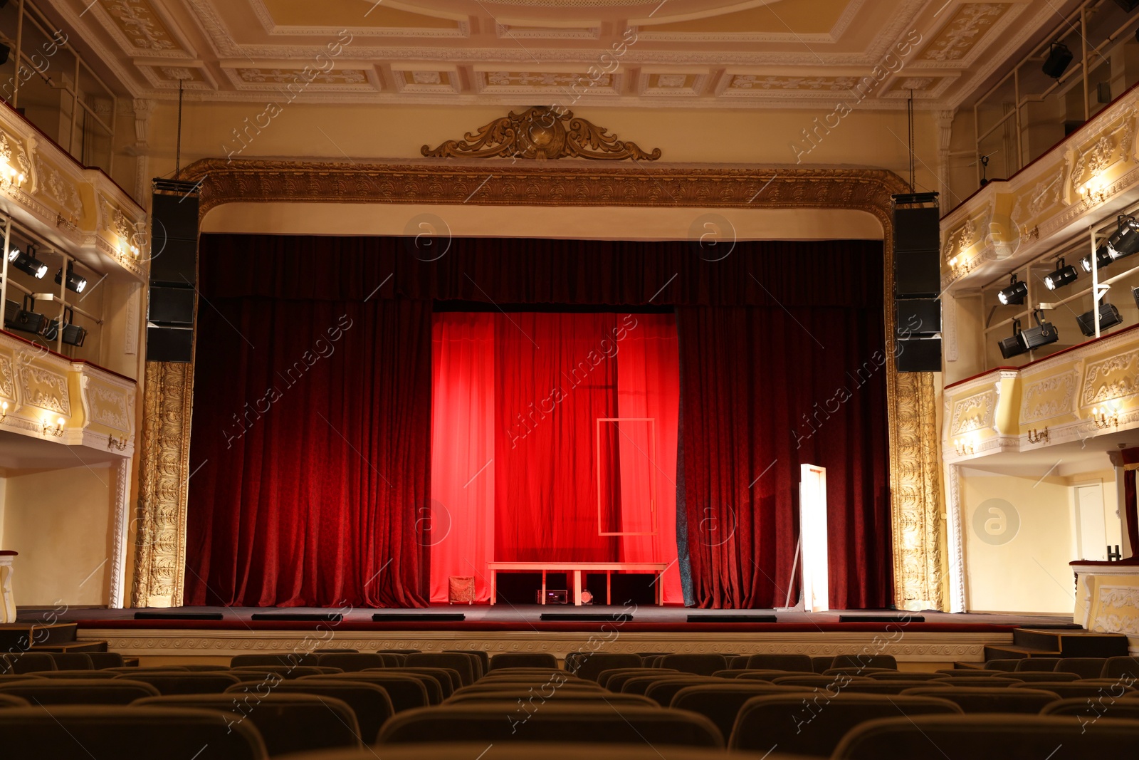 Photo of Theatre interior with stage and rows of comfortable seats