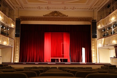 Photo of Theatre interior with stage and rows of comfortable seats