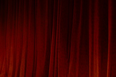 Photo of Elegant curtains in theatre as background, closeup