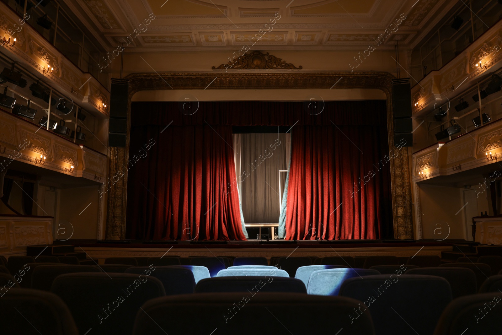 Photo of Theatre interior with stage and rows of comfortable seats