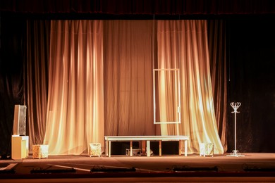 Photo of Different furniture and other decorations on stage in theatre