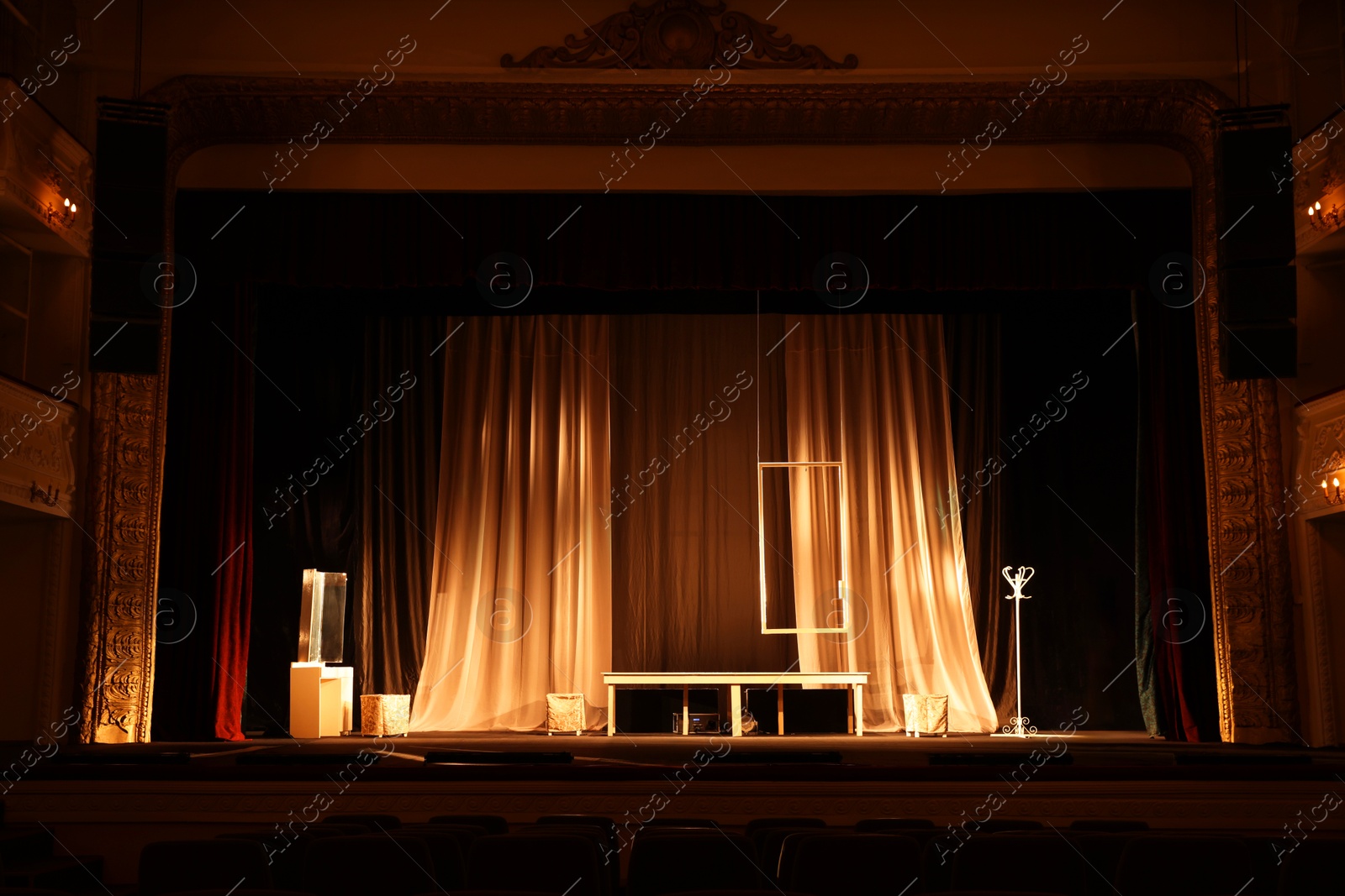 Photo of Different furniture and other decorations on stage in theatre