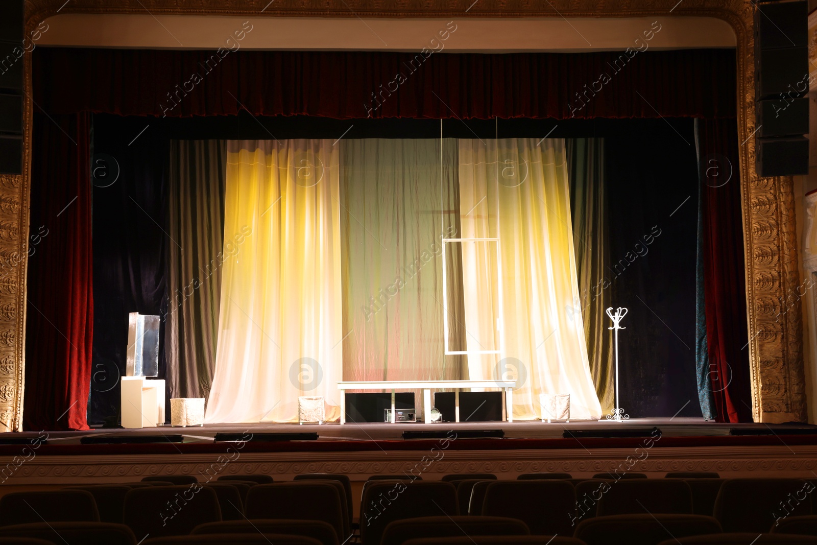 Photo of Different furniture and other decorations on stage in theatre