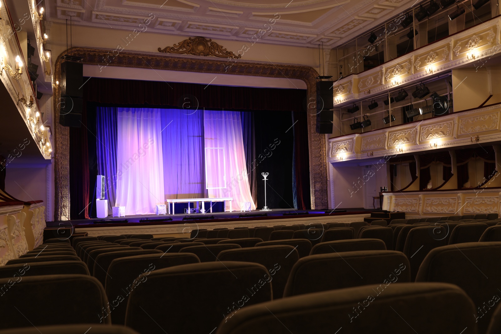 Photo of Theatre interior with stage and rows of comfortable seats