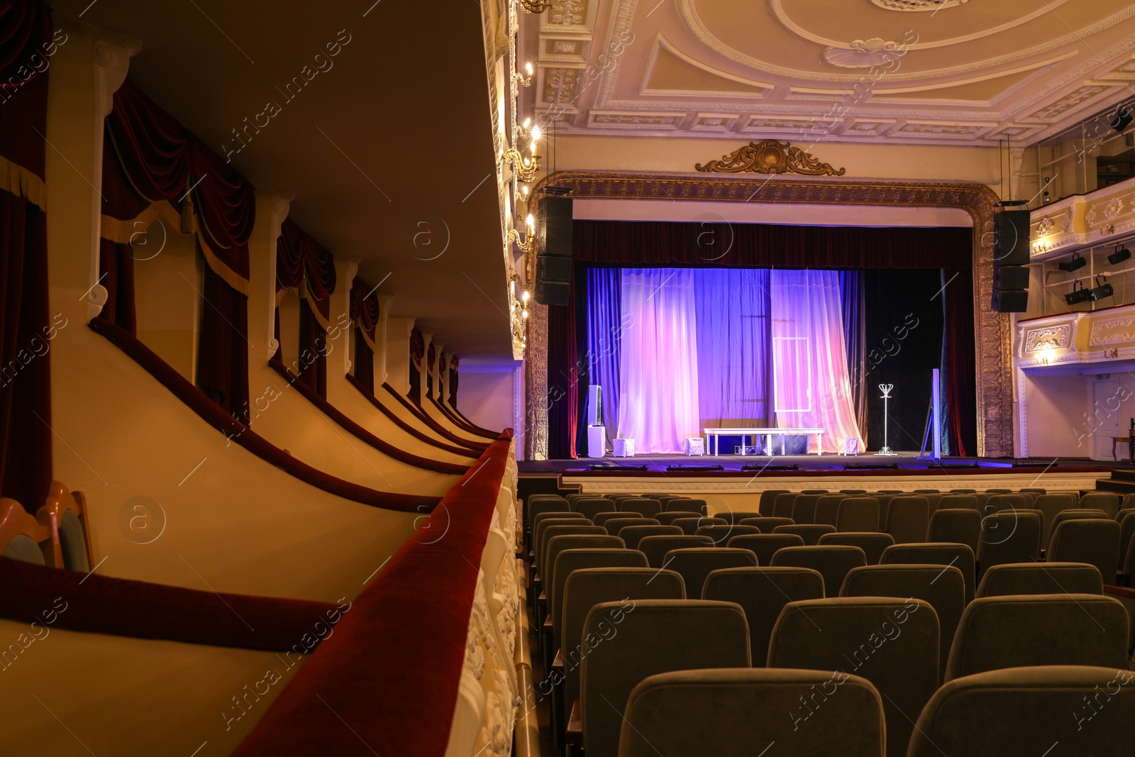 Photo of Theatre interior with stage and rows of comfortable seats