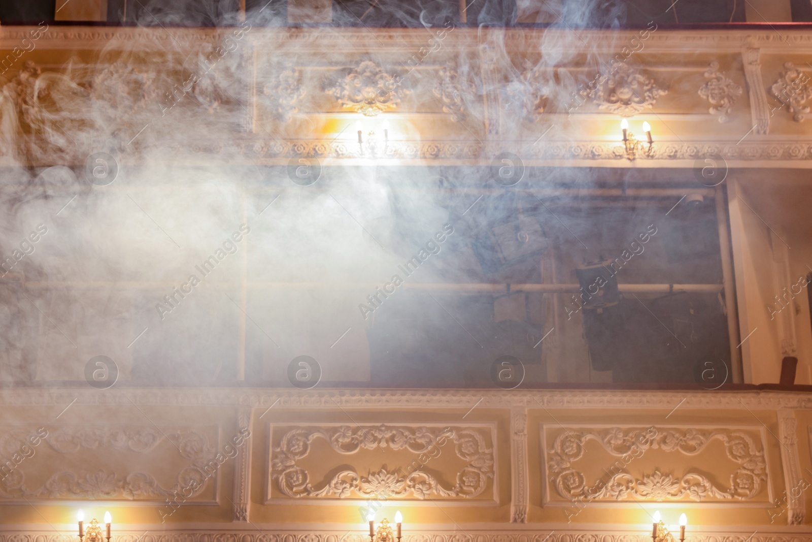 Photo of Balconies with vintage lamps and smoke in theatre