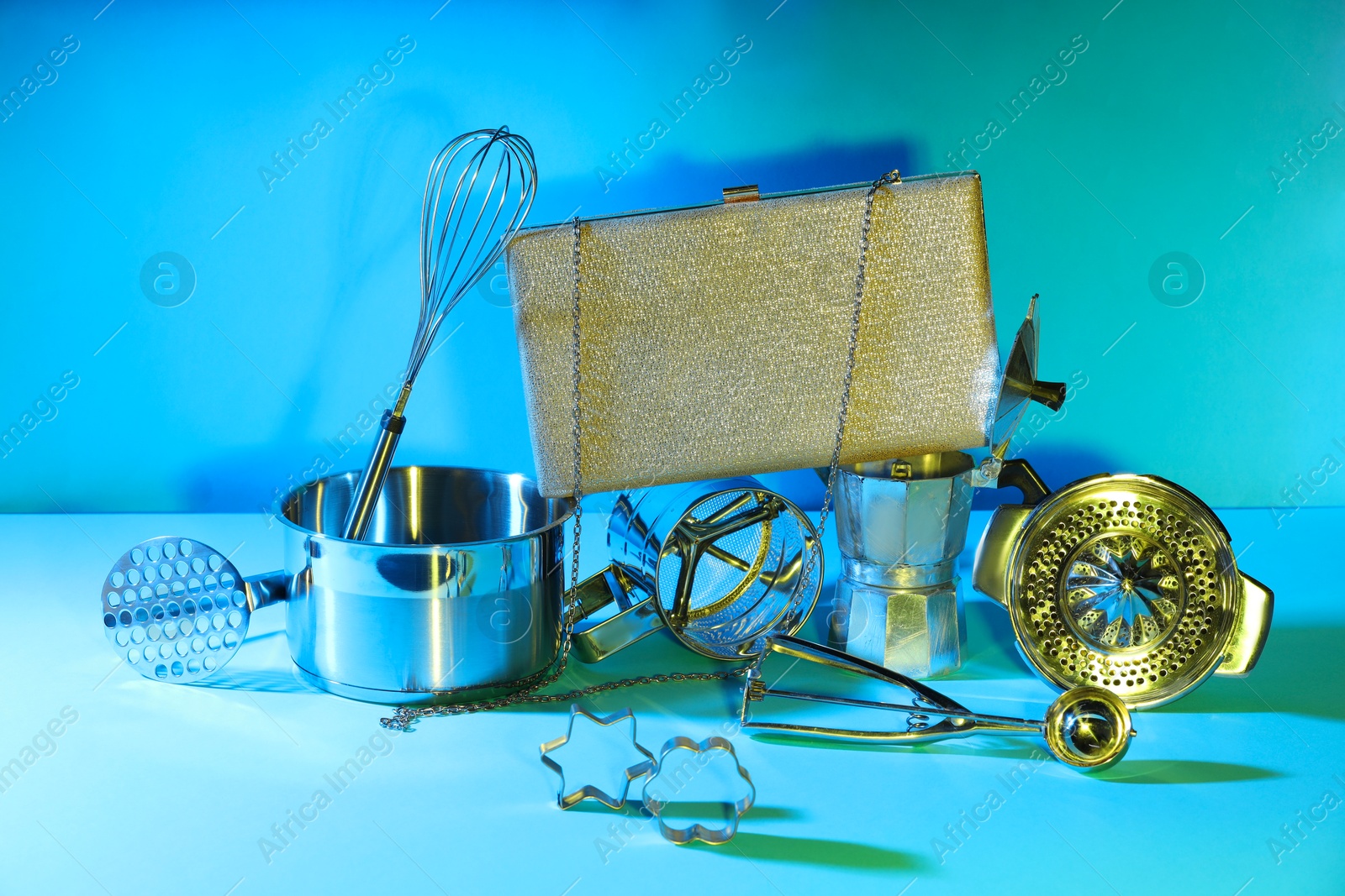 Photo of Bag and kitchen utensils on light blue background