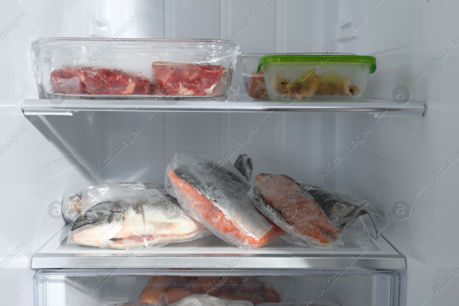 Photo of Different frozen meat and fish products in fridge