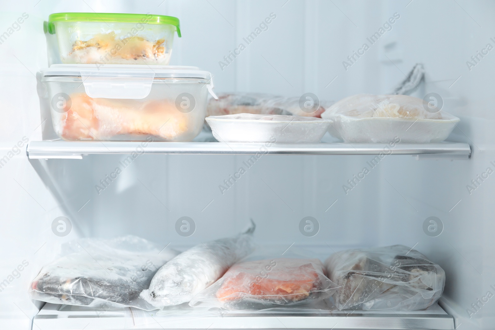 Photo of Different frozen meat and fish products in fridge