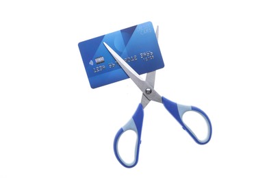 Photo of Credit card and scissors isolated on white