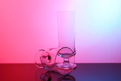 Photo of Empty glasses on table, color tone effect