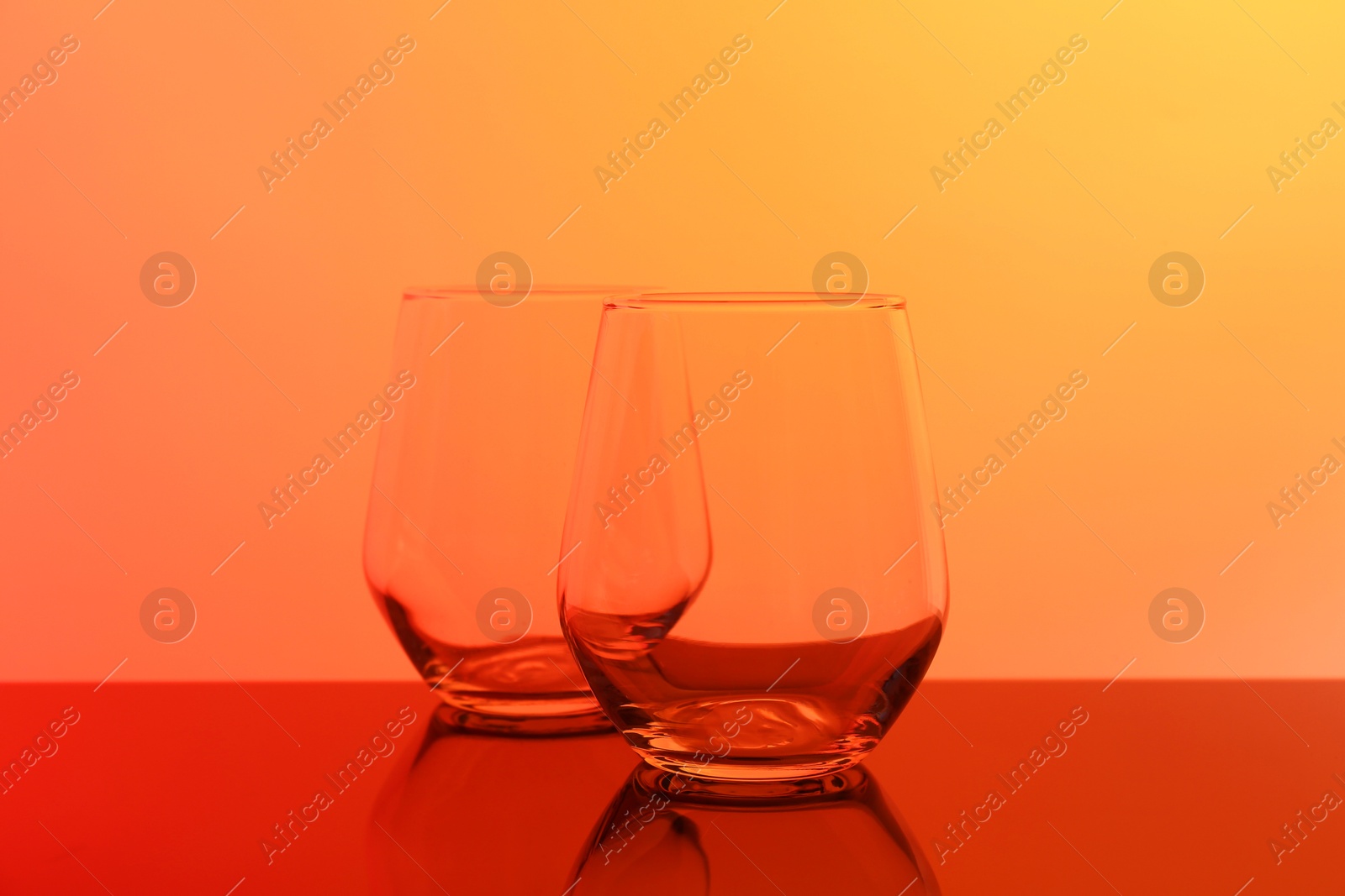 Photo of Empty glasses on table, color tone effect