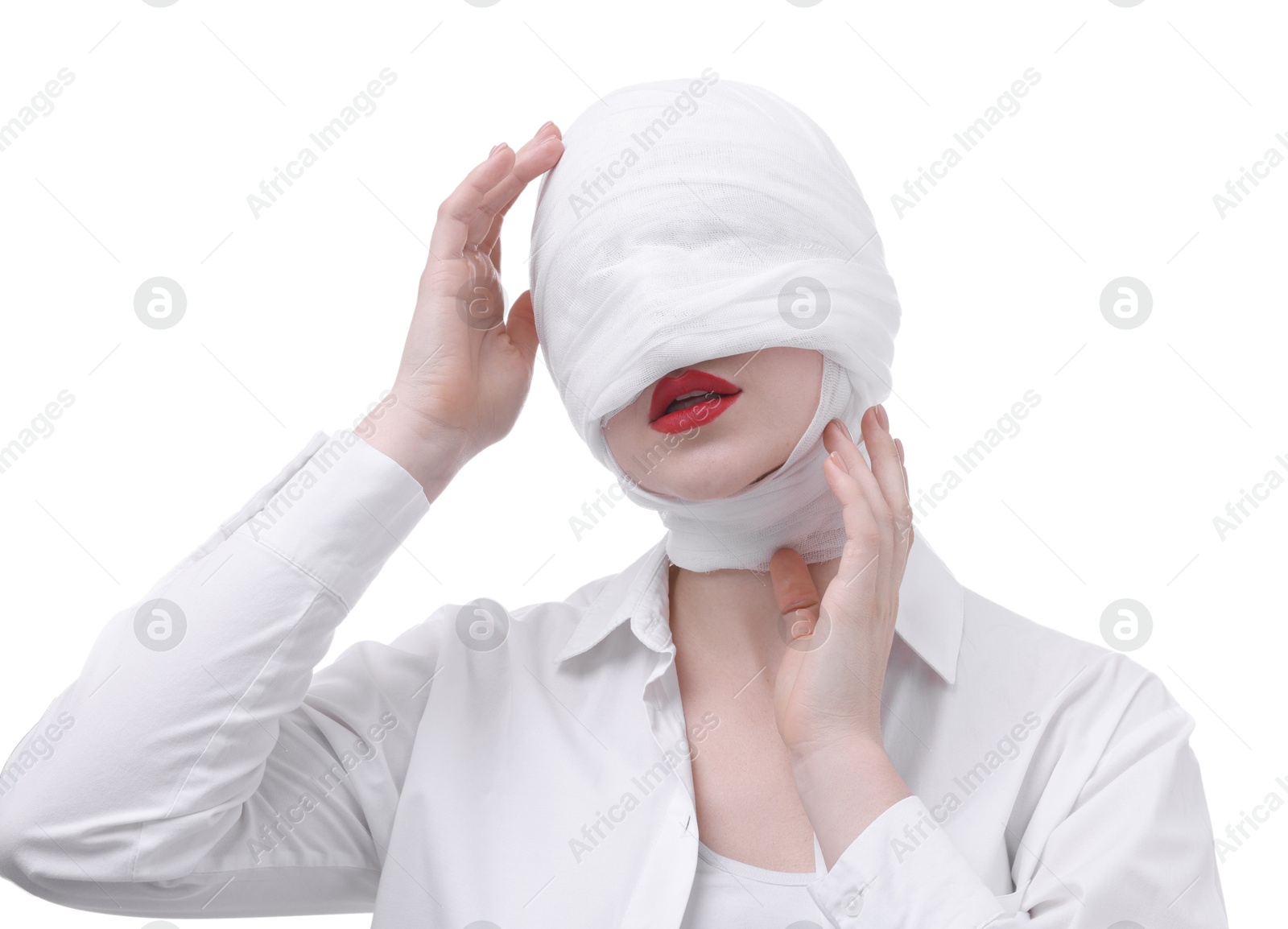 Photo of Woman with face wrapped in medical bandage after plastic surgery operation on white background