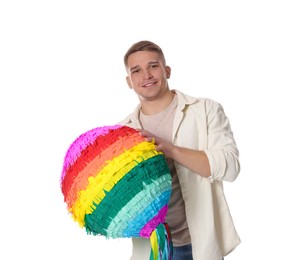 Photo of Happy man with colorful pinata on white background