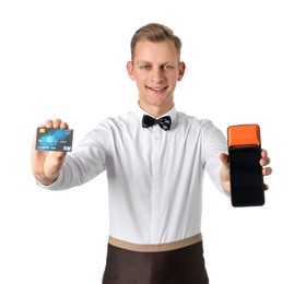 Happy waiter with payment terminal and debit card on white background