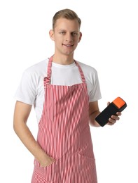 Happy young man in apron with payment terminal on white background