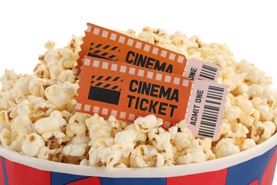 Photo of Tasty popcorn and movie tickets isolated on white