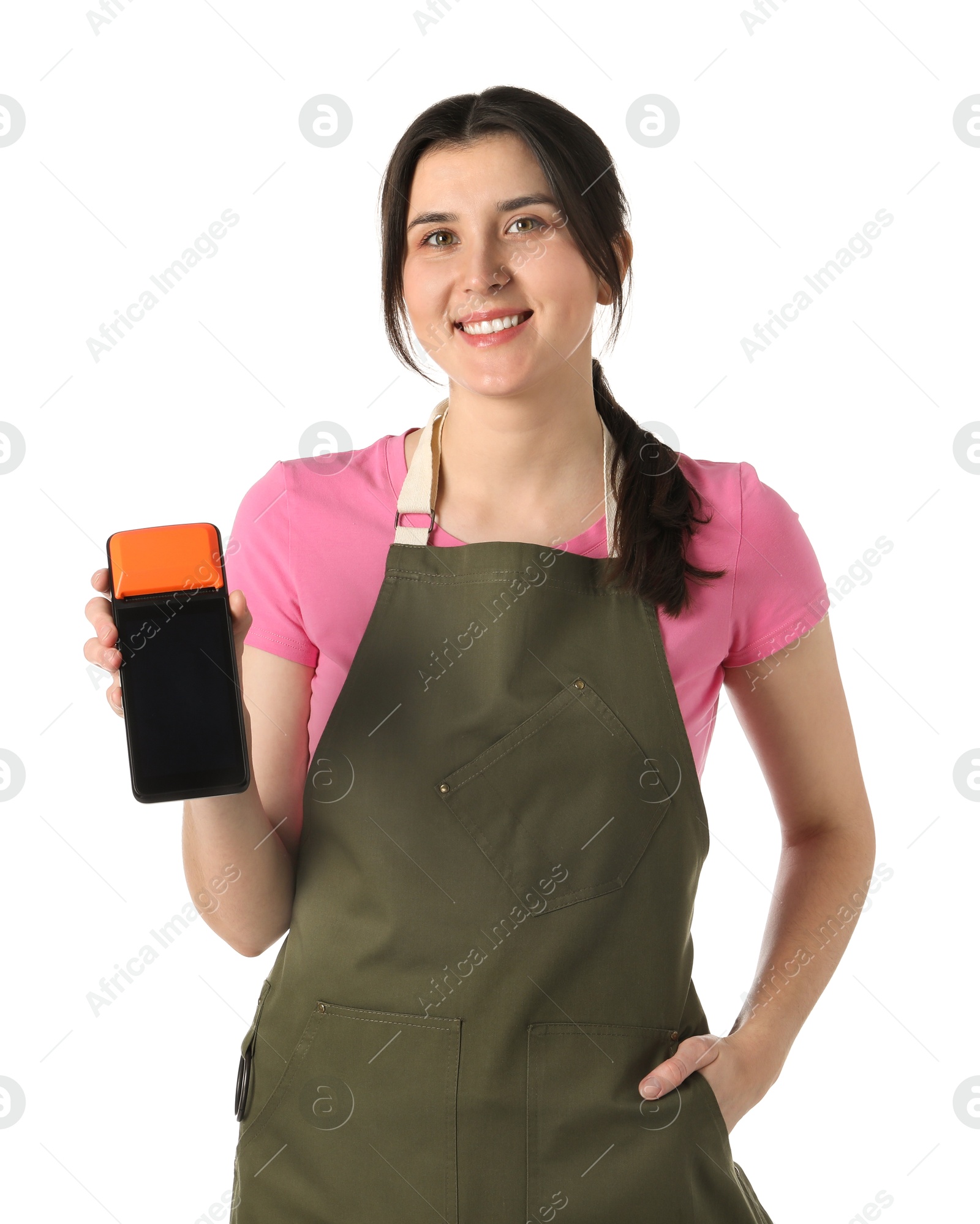 Photo of Happy young woman in apron with payment terminal on white background