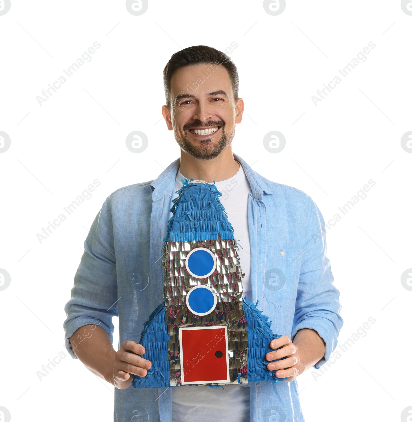 Photo of Happy man with rocket shaped pinata on white background