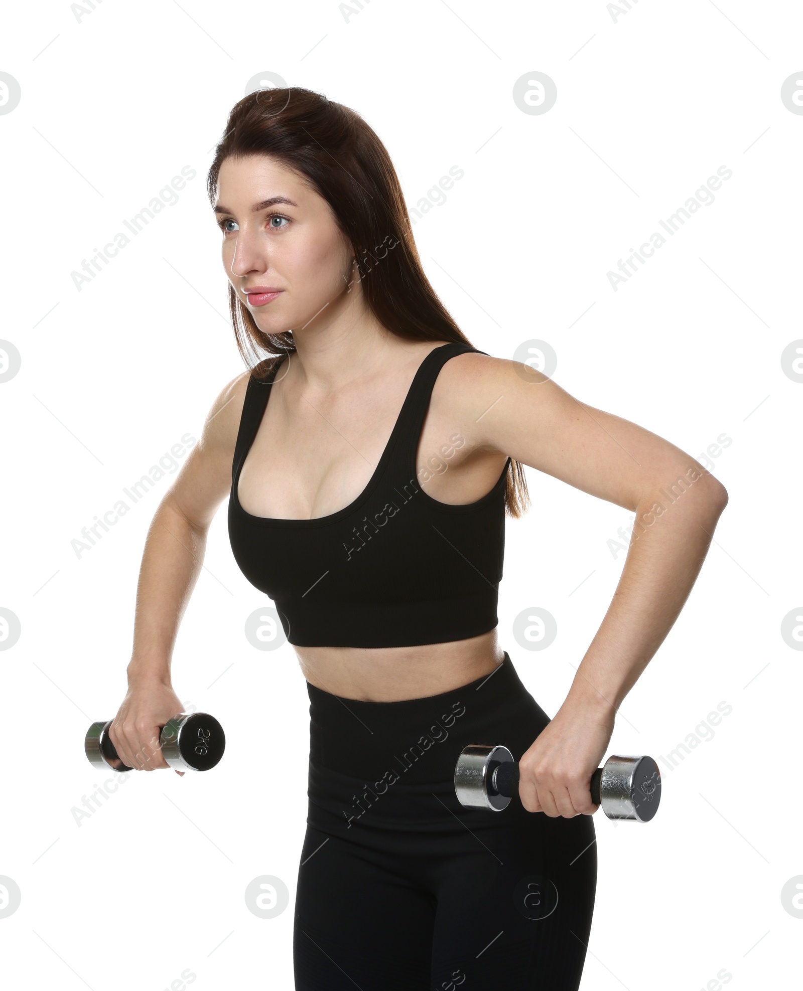 Photo of Woman in sportswear exercising with dumbbells on white background