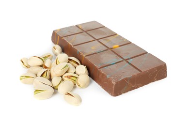 Photo of Dubai chocolate bar and pistachios isolated on white