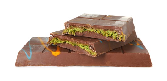 Photo of Pieces of Dubai chocolate bars with pistachio and knafeh isolated on white