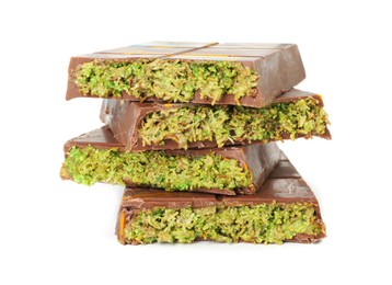 Photo of Pieces of Dubai chocolate bars with pistachio and knafeh isolated on white