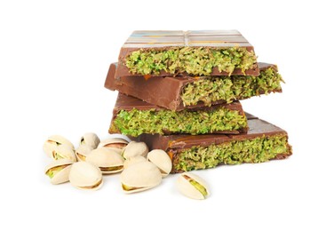 Photo of Pieces of Dubai chocolate bars and pistachios isolated on white