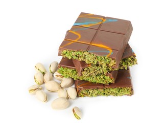 Photo of Pieces of Dubai chocolate bars and pistachios isolated on white