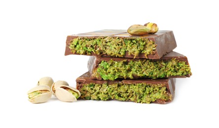 Photo of Pieces of Dubai chocolate bars and pistachios isolated on white