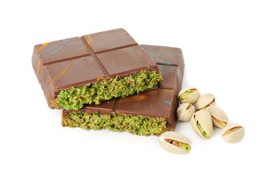 Photo of Pieces of Dubai chocolate bar and pistachios isolated on white