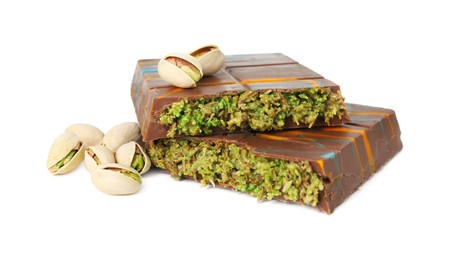 Photo of Pieces of Dubai chocolate bar and pistachios isolated on white